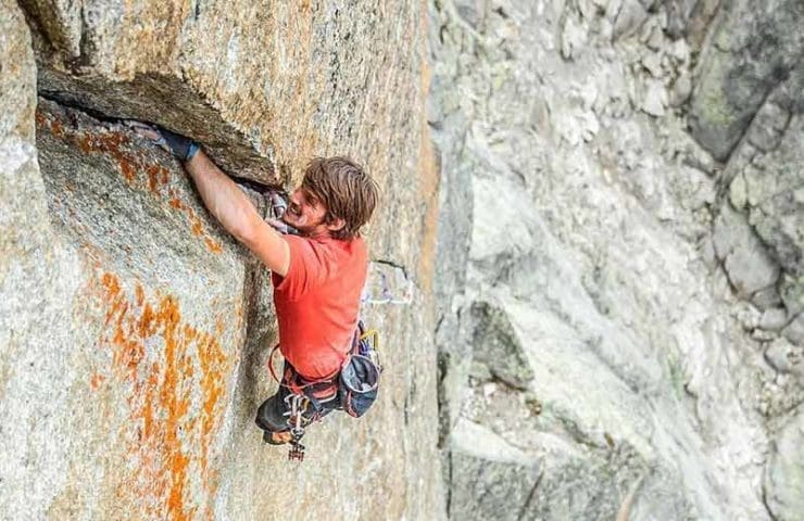 Nils Favre climbs the trad climbing route Darbellay at Petit Clocher