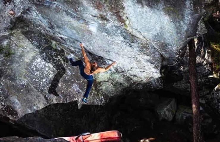 Jonas Winter climbs the 8c boulder Power of Now in Magic Wood