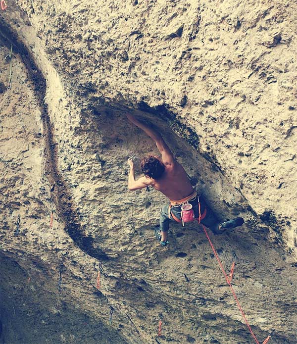 Dylan Chuat climbs Powerplay (8c) in the dwarf castle. Image: Timothée Pahud