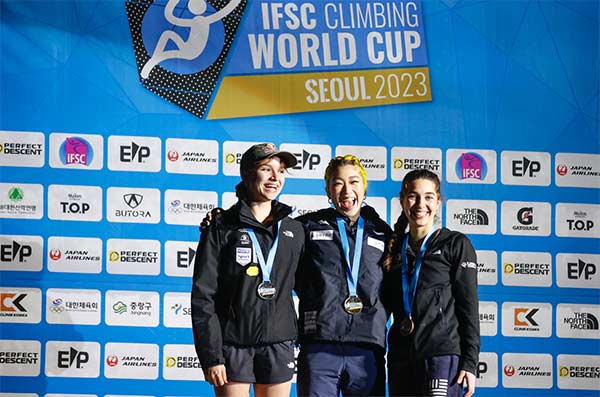 Oriane Bertone, Miho Nonaka and Brooke Raboutou on the podium at the IFSC World Cup in Seoul. Image: Dimitris Tosidis/IFSC
