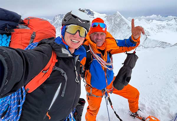 Brief luck at the summit: Marek Holeček and Matěj Bernát are happy about their first ascent of the north-west face on Sura Peak. Image: Matěj Bernát