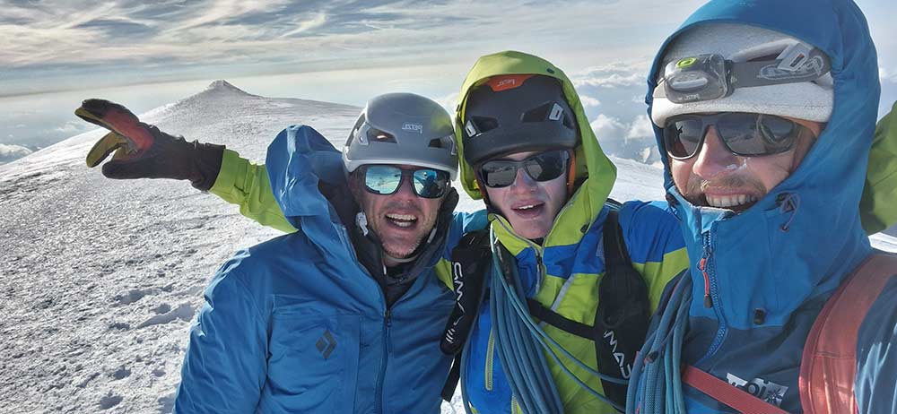 Matt Groom, Erik Heldmann and David Deichmann on the summit of Mont Blanc after climbing the last 4000 meter peak of the project, the Picco Luigi Amadeo. Image: David Deichmann