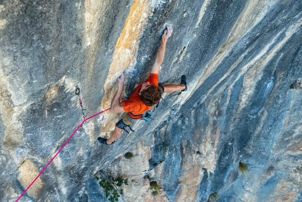 Seb Bouin repeating the Lapsus sport climbing route at Andonno_Italien_Clarisse Bompard.webp